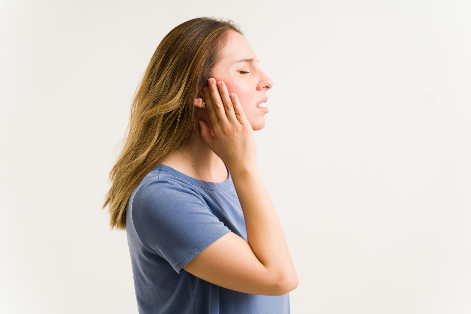 Side view of a woman with tinnitus